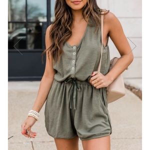 NWT. Olive green romper. Pink lily. Size M